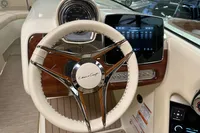 2024 Chris-Craft Launch 28 GT dashboard with steering wheel and digital display.