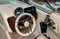 2024 Chris-Craft Launch 28 GT dashboard with steering wheel and modern controls.