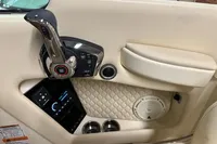 2024 Chris-Craft Launch 28 GT interior with control panel, speaker, and cup holders.