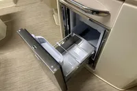 2024 Chris-Craft Launch 28 GT interior with open drawer storage compartment.