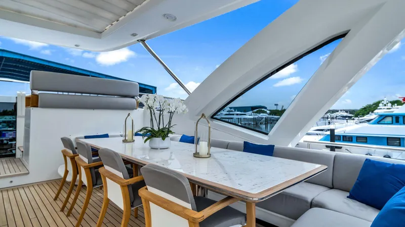 One & Only Yacht Photos Pics Luxurious dining area on 2020 Azimut Grande 32 Metri yacht with elegant seating and ocean view.