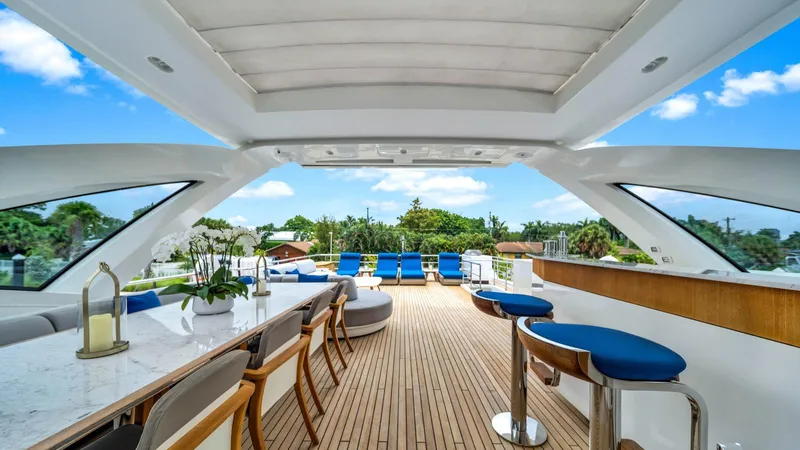 One & Only Yacht Photos Pics Luxurious Azimut Grande 32 Metri yacht interior with elegant seating and scenic views, 2020 model.
