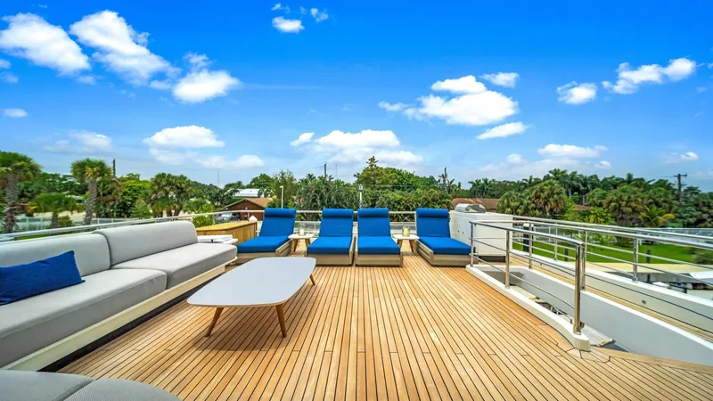 One & Only Yacht Photos Pics Luxurious deck of 2020 Azimut Grande 32 Metri yacht with sun loungers and seating.