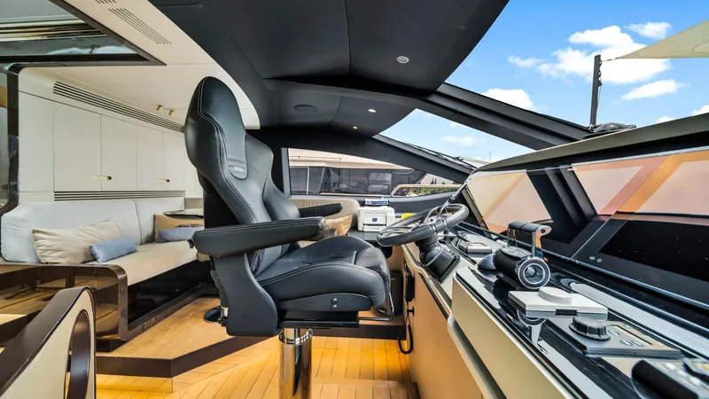 One & Only Yacht Photos Pics Luxurious interior of 2020 Azimut Grande 32 Metri yacht with modern helm and seating.