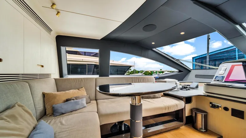 One & Only Yacht Photos Pics Luxurious interior of 2020 Azimut Grande 32 Metri yacht with modern seating and table.