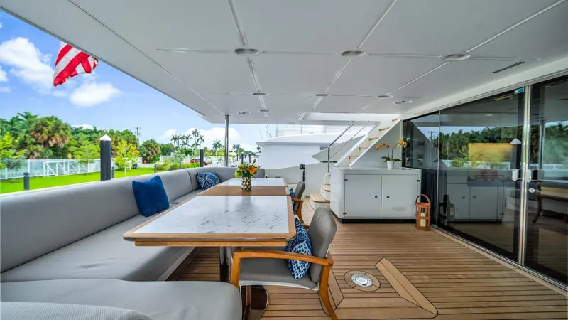 One & Only Yacht Photos Pics Luxurious deck of 2020 Azimut Grande 32 Metri yacht with elegant seating and dining area.