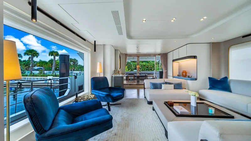 One & Only Yacht Photos Pics Luxurious interior of 2020 Azimut Grande 32 Metri yacht with elegant seating and large windows.