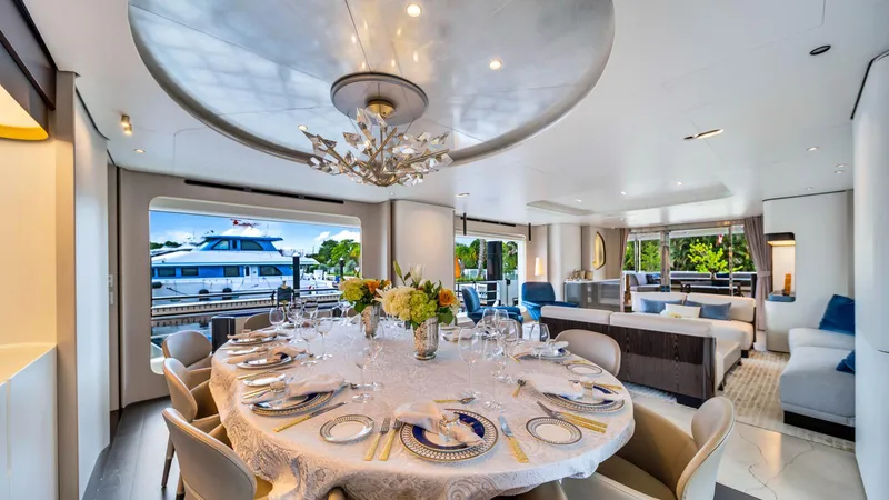 One & Only Yacht Photos Pics Luxurious interior of 2020 Azimut Grande 32 Metri yacht with elegant dining setup.