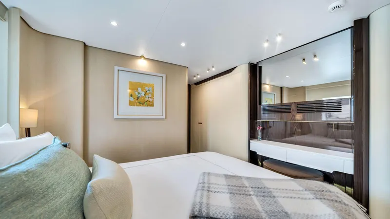 One & Only Yacht Photos Pics Luxurious bedroom interior on 2020 Azimut Grande 32 Metri yacht, featuring elegant decor and modern amenities.