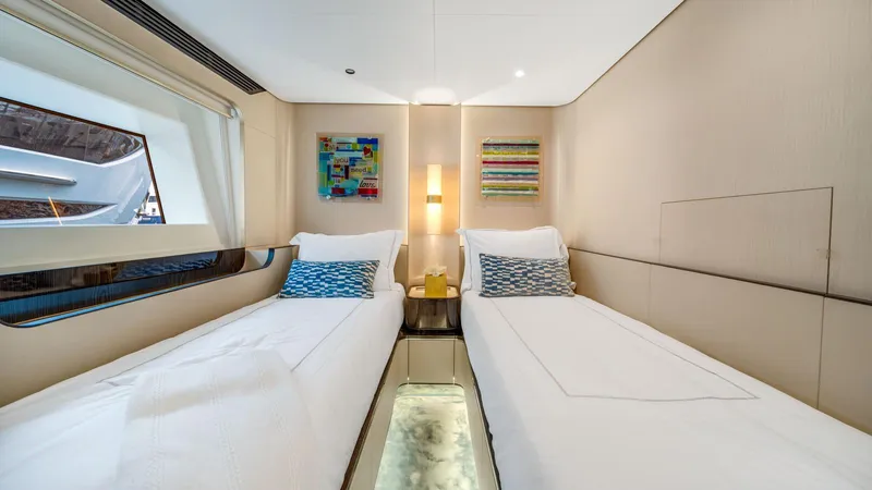 One & Only Yacht Photos Pics Luxurious twin cabin on 2020 Azimut Grande 32 Metri yacht, featuring modern decor and elegant lighting.