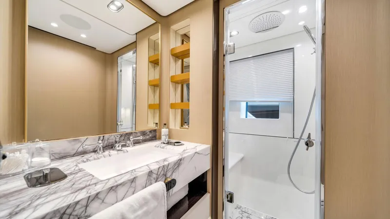 One & Only Yacht Photos Pics Luxurious bathroom in 2020 Azimut Grande 32 Metri yacht with marble sink and modern shower.