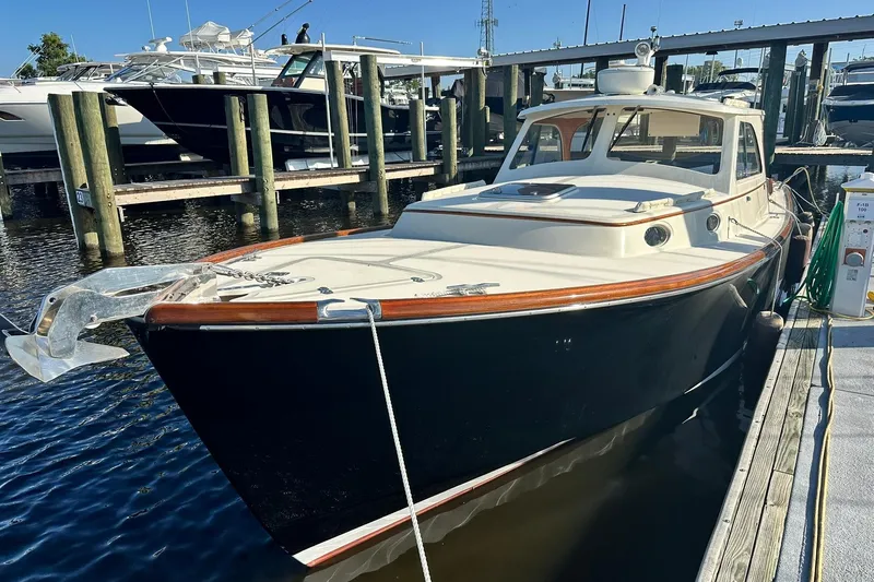Lida Yacht Photos Pics 2000 Hinckley Picnic Boat 36 docked at marina, showcasing elegant design and craftsmanship.