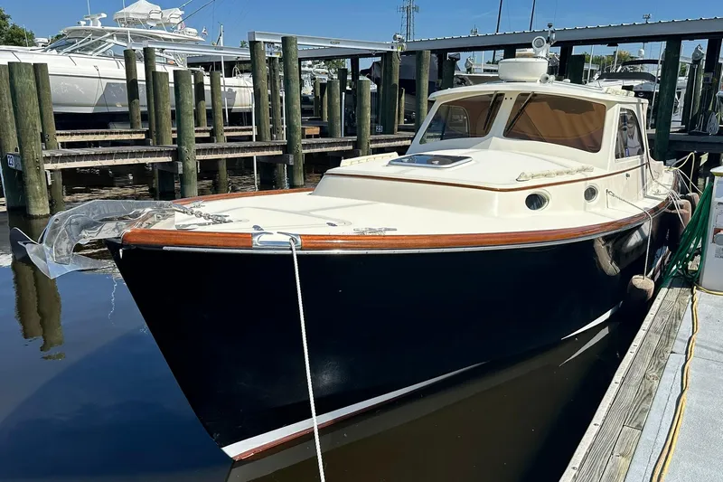 Lida Yacht Photos Pics 2000 Hinckley Picnic Boat 36 docked at a marina, showcasing classic design.