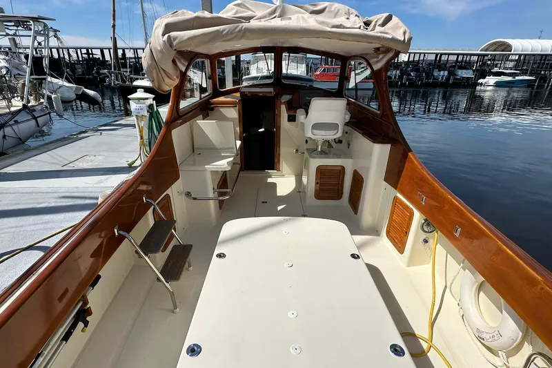 Lida Yacht Photos Pics Hinckley Picnic Boat 36, 2000 model, docked with elegant wooden interior and spacious deck.