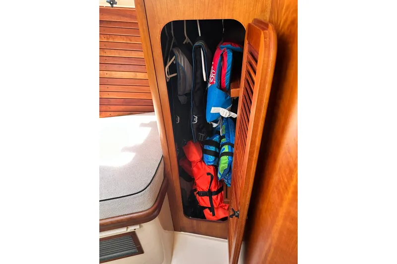 Lida Yacht Photos Pics Storage compartment with life jackets on a 2000 Hinckley Picnic Boat 36.
