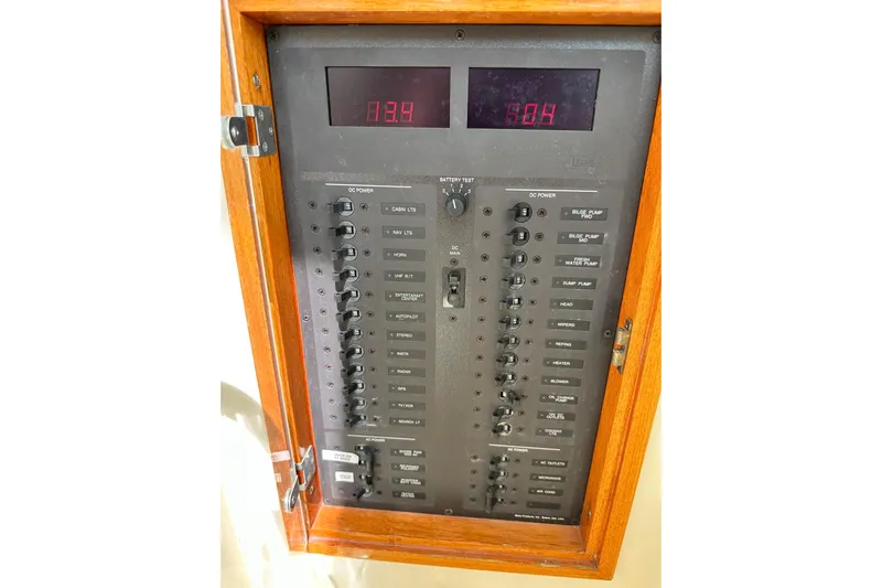 Lida Yacht Photos Pics Electrical control panel on a 2000 Hinckley Picnic Boat 36, featuring switches and digital displays.