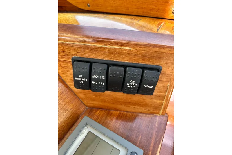 Lida Yacht Photos Pics Control panel of a 2000 Hinckley Picnic Boat 36 with labeled switches.