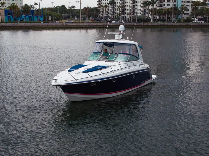  Yacht Photos Pics 2008 Formula 40 Performance Cruiser on calm water near urban shoreline.