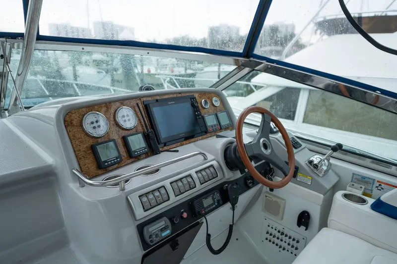  Yacht Photos Pics 2008 Formula 40 Performance Cruiser helm with gauges, steering wheel, and navigation equipment.