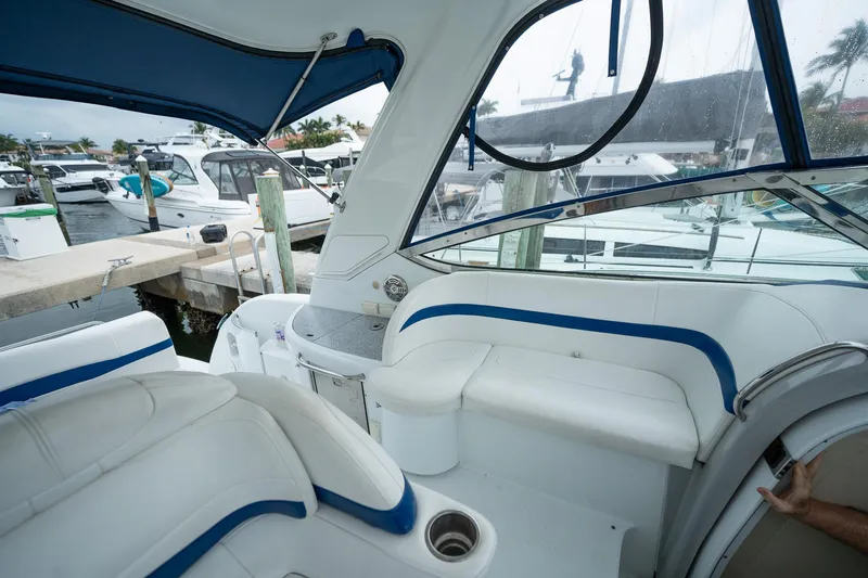  Yacht Photos Pics 2008 Formula 40 Performance Cruiser interior with white seating and blue accents at a marina.