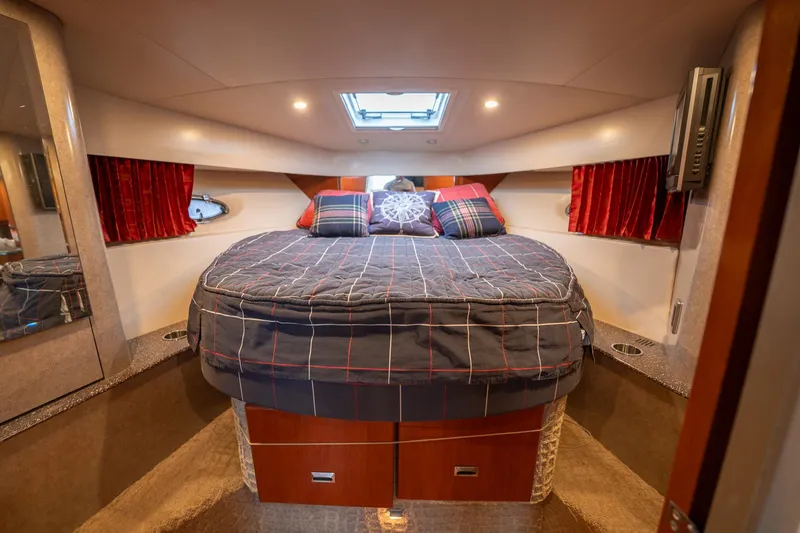  Yacht Photos Pics Luxurious cabin interior of a 2008 Formula 40 Performance Cruiser with cozy bedding.