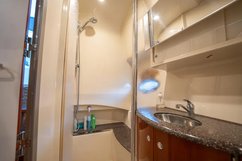  Yacht Photos Pics 2008 Formula 40 Performance Cruiser bathroom with shower, sink, and storage cabinets.