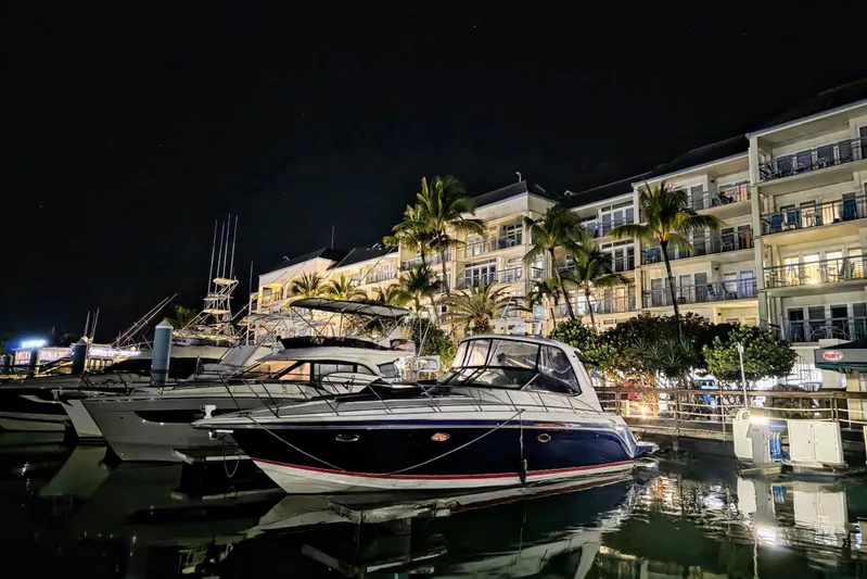  Yacht Photos Pics 2008 Formula 40 Performance Cruiser docked at night, illuminated by nearby buildings.