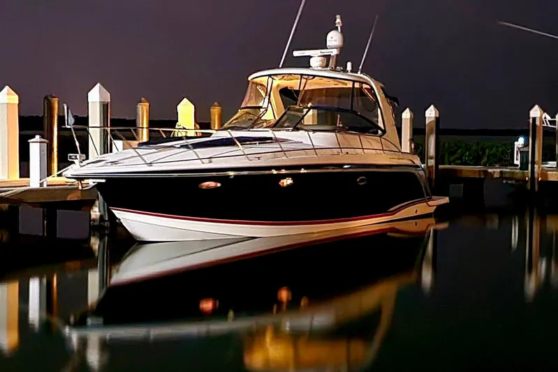  Yacht Photos Pics 2008 Formula 40 Performance Cruiser docked at night, reflecting on calm water.
