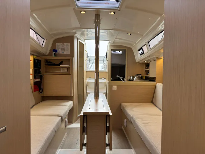 Stinger Yacht Photos Pics Interior of 2022 Beneteau Oceanis 30.1 sailboat, featuring cozy seating and modern design.