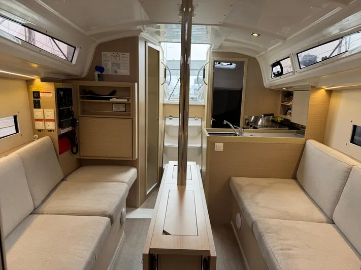 Stinger Yacht Photos Pics Interior of 2022 Beneteau Oceanis 30.1 sailboat with modern seating and compact kitchen.