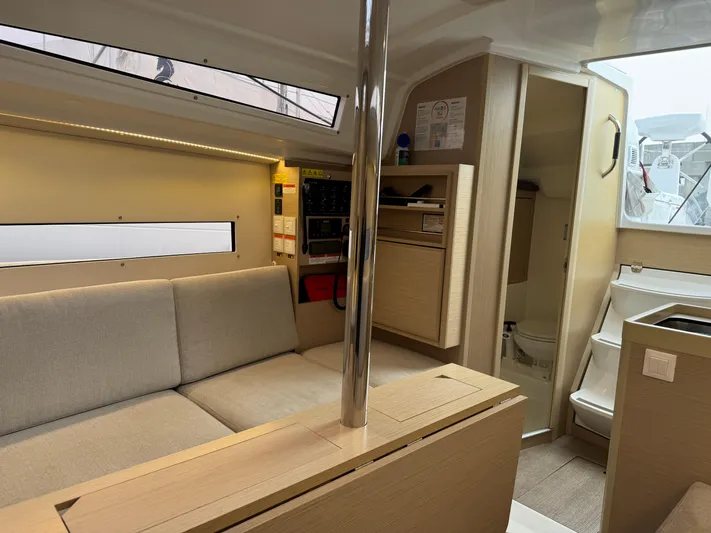 Stinger Yacht Photos Pics Interior of 2022 Beneteau Oceanis 30.1 yacht, featuring modern seating and compact design.