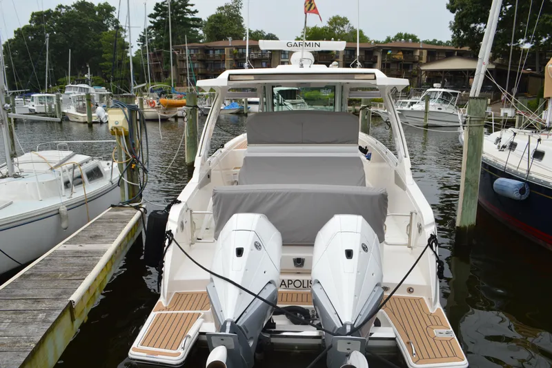 Encore Yacht Photos Pics 2023 Tiara Yachts 34 LS docked, featuring dual outboard engines and spacious seating.