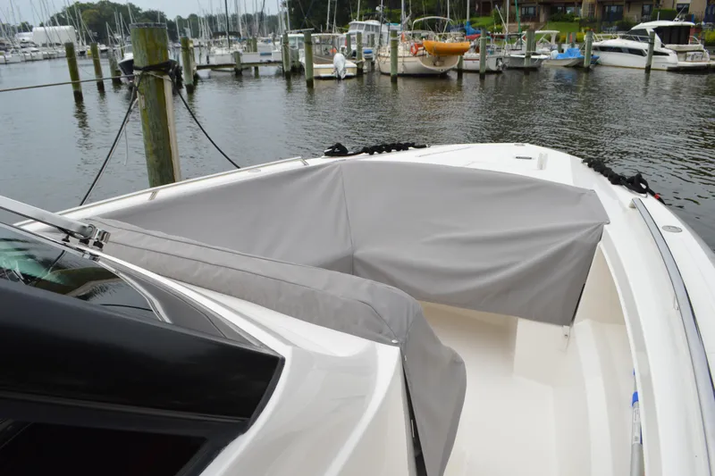 Encore Yacht Photos Pics 2023 Tiara Yachts 34 LS boat with gray cover docked at marina.