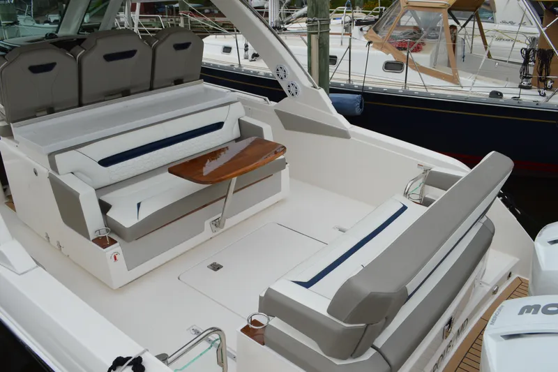 Encore Yacht Photos Pics 2023 Tiara Yachts 34 LS luxury boat interior with seating and table.