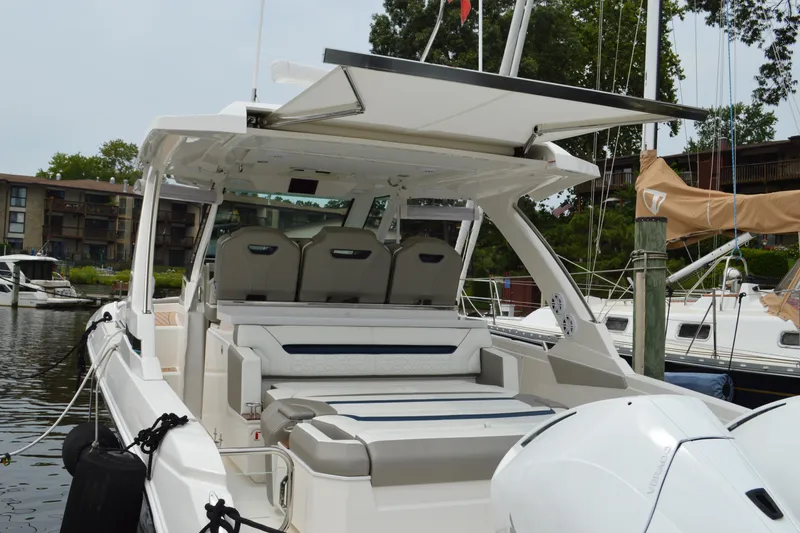 Encore Yacht Photos Pics 2023 Tiara Yachts 34 LS luxury boat docked, featuring spacious seating and modern design.