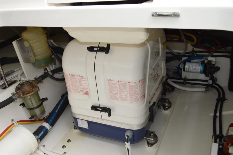 Encore Yacht Photos Pics Engine compartment of 2023 Tiara Yachts 34 LS, showcasing mechanical components and wiring.