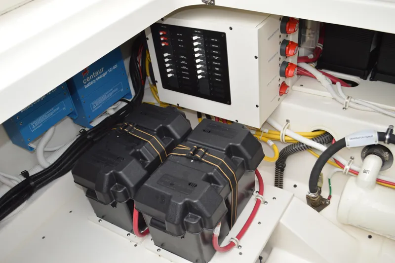 Encore Yacht Photos Pics Electrical system of 2023 Tiara Yachts 34 LS, featuring battery chargers and wiring.