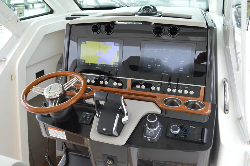 Encore Yacht Photos Pics 2023 Tiara Yachts 34 LS helm with advanced navigation displays and controls.