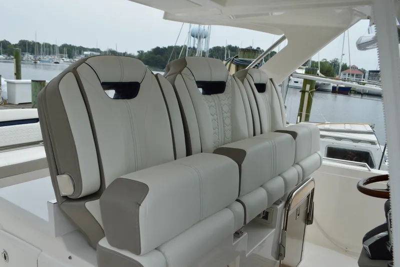 Encore Yacht Photos Pics 2023 Tiara Yachts 34 LS boat seats, luxurious design, docked at marina.