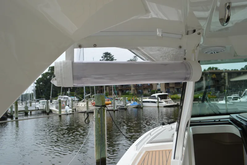 Encore Yacht Photos Pics 2023 Tiara Yachts 34 LS, featuring a sleek design at a marina.