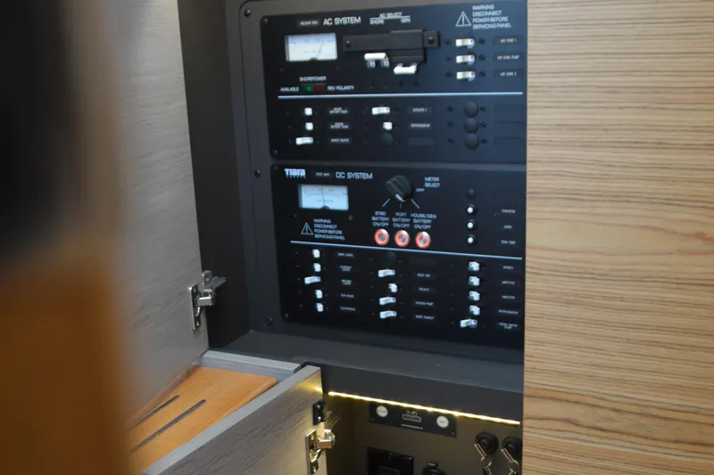 Encore Yacht Photos Pics Electrical control panel on 2023 Tiara Yachts 34 LS, featuring AC and DC systems.