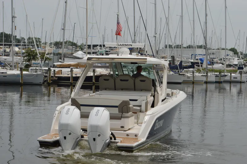 Encore Yacht Photos Pics 2023 Tiara Yachts 34 LS in marina, featuring dual outboard engines.