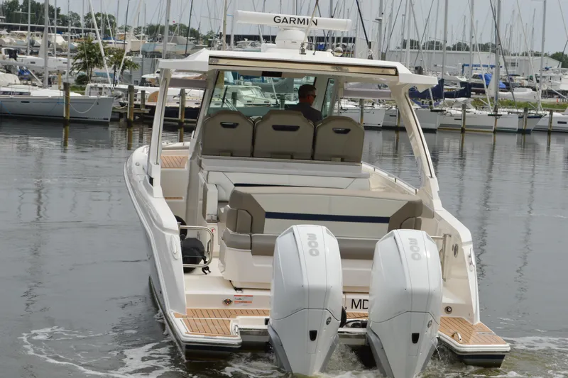 Encore Yacht Photos Pics 2023 Tiara Yachts 34 LS with dual engines, docked in a marina.