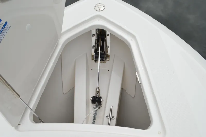 Encore Yacht Photos Pics 2023 Tiara Yachts 34 LS anchor locker with open hatch and chain mechanism.