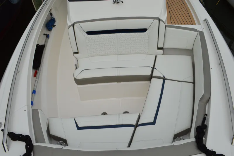 Encore Yacht Photos Pics 2023 Tiara Yachts 34 LS boat interior with white cushioned seating.