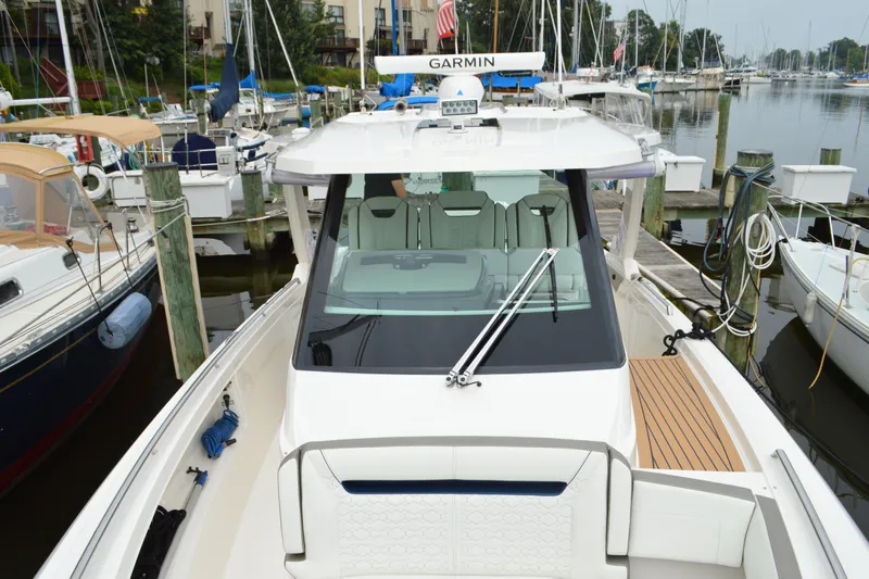 Encore Yacht Photos Pics 2023 Tiara Yachts 34 LS docked at marina, featuring sleek design and modern amenities.