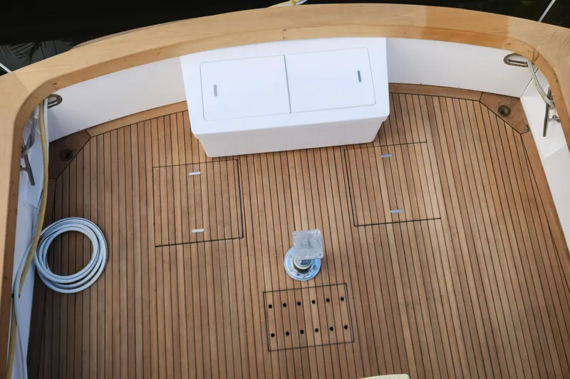 Miss Phebe II Yacht Photos Pics 1971 Whiticar Sportfish boat deck with teak flooring and storage compartments.