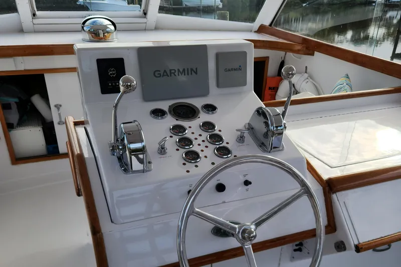Miss Phebe II Yacht Photos Pics 1971 Whiticar Sportfish helm with Garmin navigation system and classic controls.