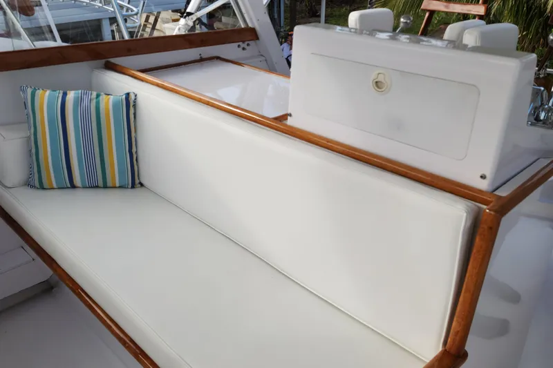 Miss Phebe II Yacht Photos Pics 1971 Whiticar Sportfish boat with white seating and striped cushion.