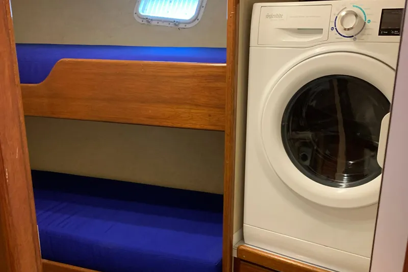 Miss Phebe II Yacht Photos Pics 1971 Whiticar Sportfish interior with bunk beds and washing machine.